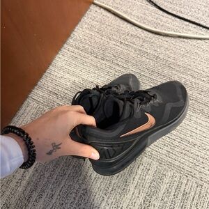 Nike Black Shoes with Metallic Swoosh